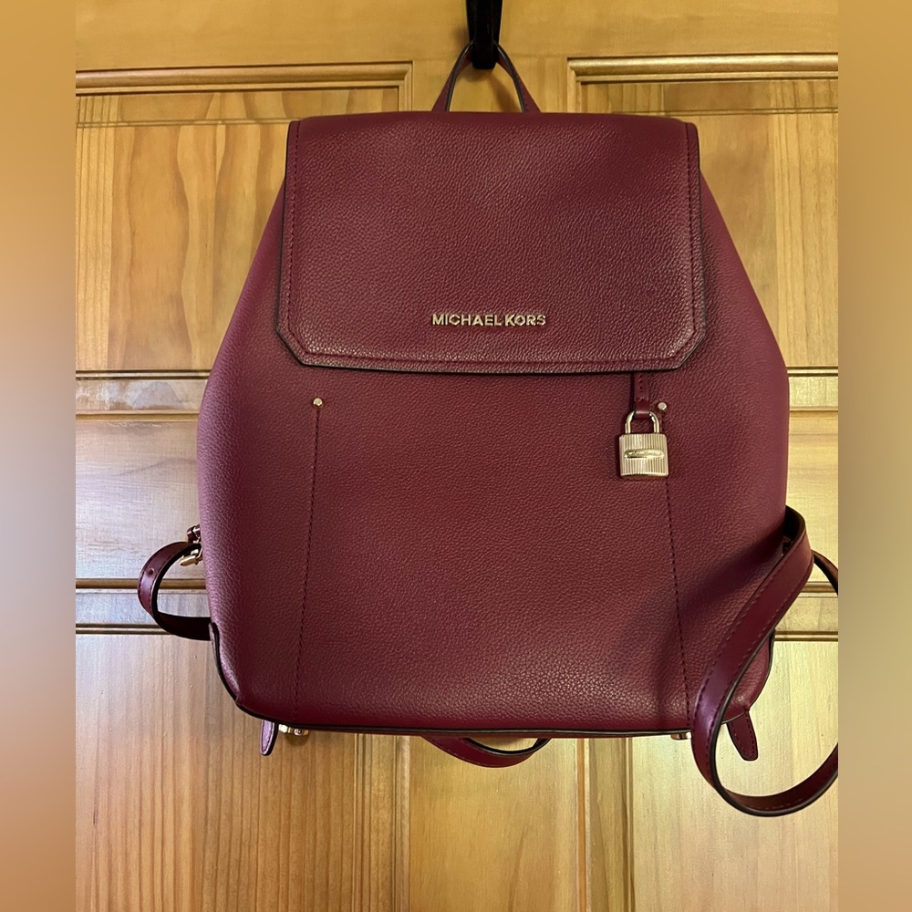 Micheal Kors wine/maroon color backpack
